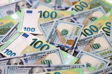 Big pile of Euro and USD banknotes. Many european and united states dollars