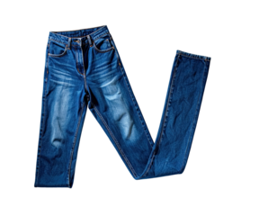 Folded pair of blue jeans on black background.  Faded denim, straight leg style,  with  distressed areas