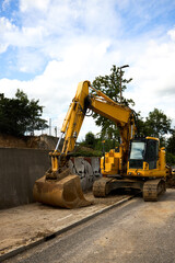 Road repair in urban environment. Repair with large equipment. Repair barriers. Demolition. Excavator work.