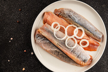 Herring fillet fish fresh seafood portion size natural product tasty snack fresh delicious gourmet food background on the table rustic top view copy space pescetarian diet