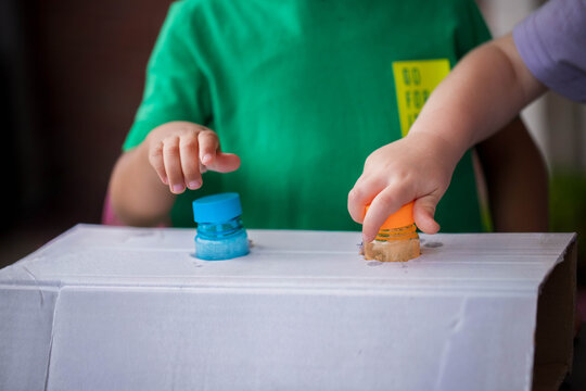 Children playing with bubble solution - Powered by Adobe