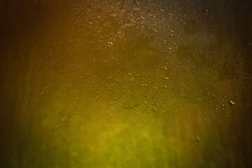 Wet glass. Drops on glass. Abstract texture. Colored highlights