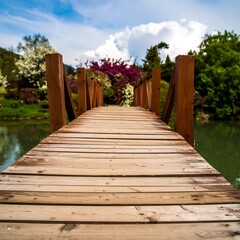 Obraz premium Wooden bridge over a pond, flowers in bloom