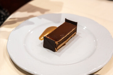 A piece of chocolate cake that looks like a bed