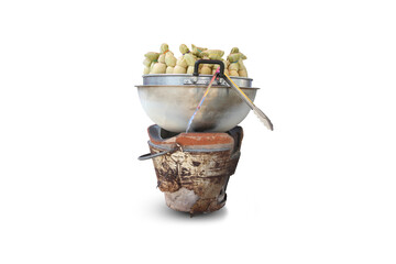 Boiling corn with an old charcoal stove;White background