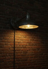 Industrial lamp illuminates brick wall in vintage interior