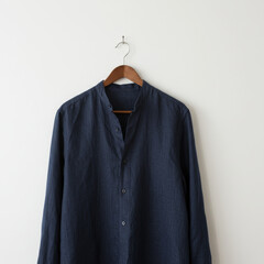 Shirt hangs displaying style in a minimalist studio