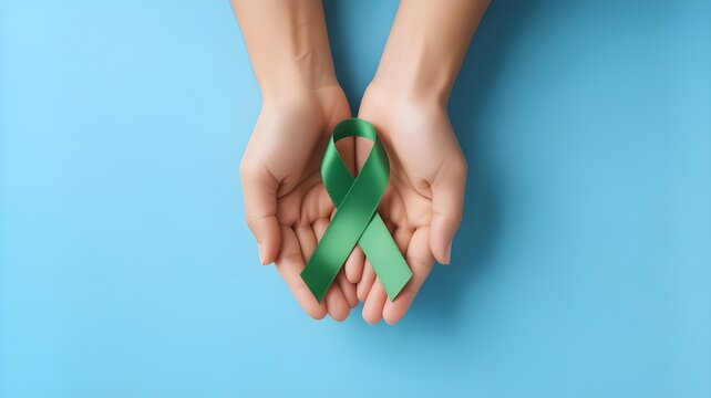 September World lymphoma and October Mental health day Awareness month, Woman holding lime green Ribbon color on blue background for supporting people living, and illness. Healthcare concepts - Powered by Adobe