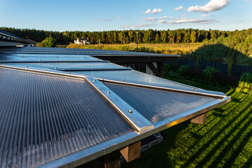 The terrace covering is visible from above, the roof is covered with polycarbonate.