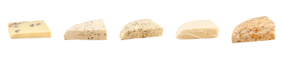 Assortment of Ayvalık cheeses with herbs, spices, black cumin, and walnuts, wedges and blocks isolated on white background highlighting seasoning details.