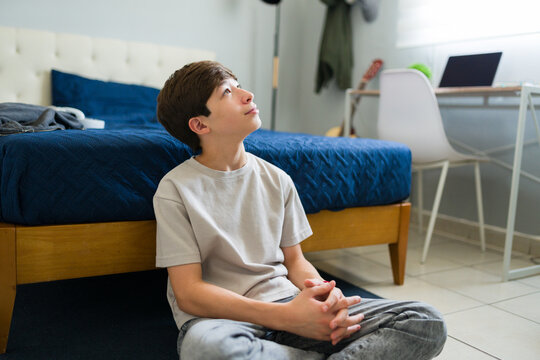 Pensive teenager contemplating in bedroom: exploring thoughts and dreams - Powered by Adobe