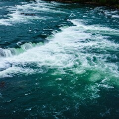 Fototapeta premium Turbulent River Rapids Flow with Foaming Whitewater