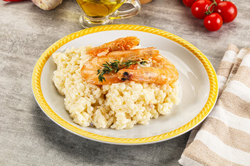 Italian risotto with prawn served thyme