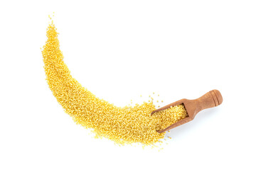 Fototapeta premium Millet, ancient African grain, in a scoop on a white background, overhead flat lay shot. Healthy vegan side dish