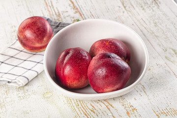 Ripe sweet juicy nectarines heap
