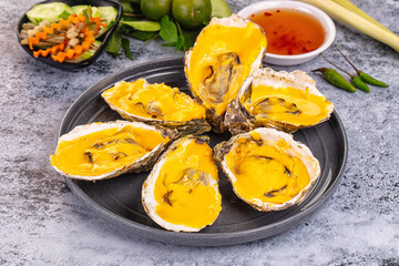 Baked oyster with cheddar cheese