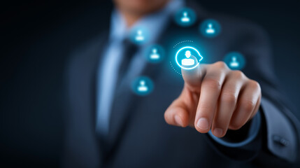 A businessman presses a glowing button on a futuristic HR dashboard recruitment icons of profiles and magnifying glasses expand outward in luminous blue. The scene radiates precis