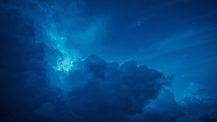Fototapeta premium Vibrant Blue Clouds with Soft Light Radiating Through