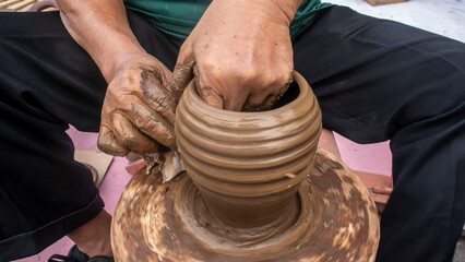 a potter is making pottery