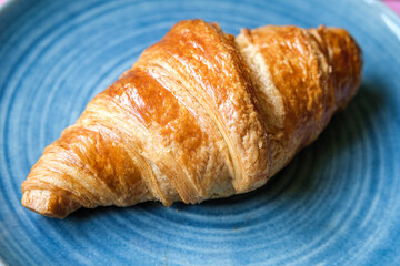 Single Butter Croisant Served On A Plate