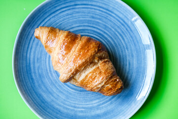 Single Butter Croisant Served On A Plate