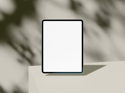 Tablet screen mockup with shadow on muted green abstract background
