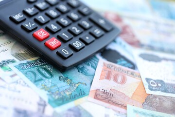 Egyptian pound currency money bills and calculator. The concept of taxation and money count