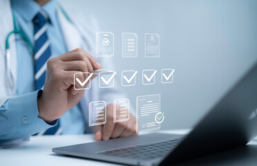 Doctor using laptop with digital checklist and approval documents hologram representing healthcare...