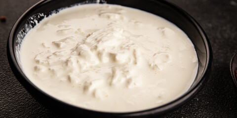 Stracciatella cheese soft young portion size Italian food natural product tasty snack fresh delicious gourmet food background on the table rustic top view copy space