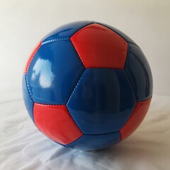 Fototapeta premium Red and blue shiny soccer ball on a white background