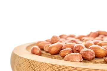 Peeled raw peanuts isolated on white background, close-up.