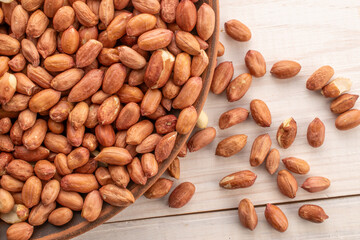 Peeled raw peanuts, top view, macro.