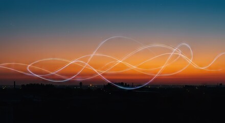 A sunset silhouette of a cityscape overlaid with bright swirling light trails