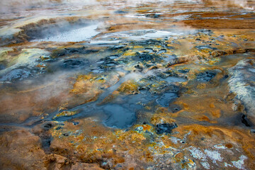 Geothermal landscape of Hverir near Lake Myvatn in Iceland with steam vents and bubbling mud pools