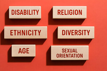 Gender age ethnicity religion disability orientation and diversity text on wood blocks, equality and human rights concept background