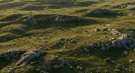 Naklejka premium Aerial View of Rolling Hills and Rocky Terrain