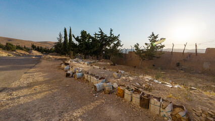 Rural Landscape with Dirt Road and Barrels. Syria, Sednaya Prison.