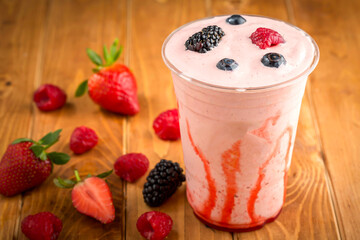 Mixed Berries Smoothie with Strawberries, Raspberries, and Blackberries in glass side view of healthy drink