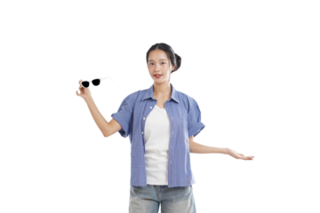 Young Woman with Sunglasses: A stylish young woman in casual wear holds a pair of sunglasses, presenting them with confidence. She is radiating casual cool and self-assuredness.