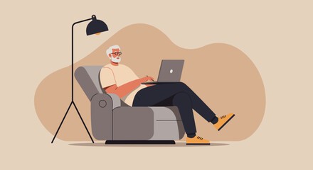 Senior man comfortably working from home on a laptop in an armchair with a lamp. Remote work, online learning, and relaxed digital lifestyle concept.
