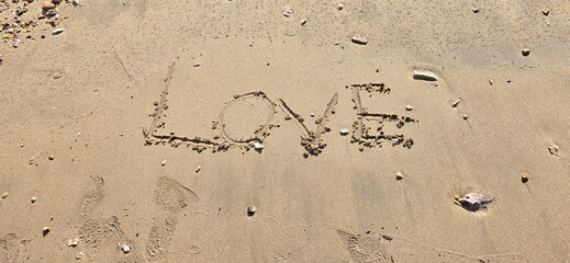 Tourists write the word 