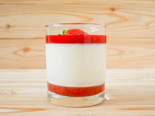 Panna cotta with strawberry coulis and fresh strawberry