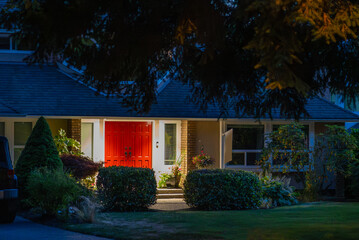 Entrance of luxury house with nice green Summer landscape at night in Vancouver, Canada, North America. August 2025.