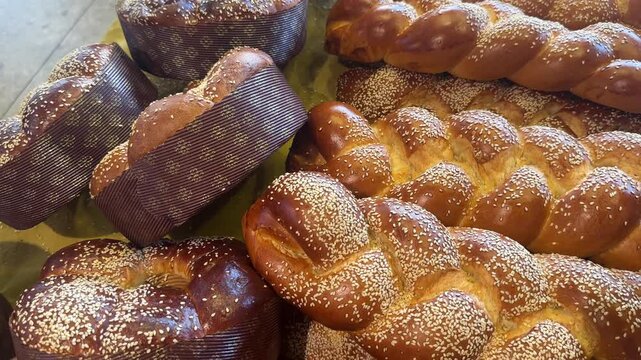 Fresh assortment of breads and pastries displayed together, including loaves, rolls, and sweet baked goods, symbolizing artisanal baking and authentic culinary tradition.