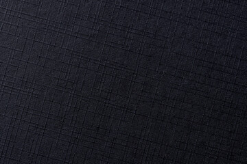 Close-up of black macro fiberglass surface detail,Horizontal landscape photo of black carbon fiber textured panel,Black plastic closeup surface texture.