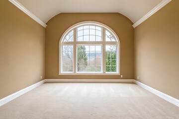 Obraz premium Spacious Room with Large Arch Window and Tan Walls