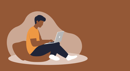 Young man works remotely on his laptop from a comfortable home setting. Ideal for themes of online education, freelance work, or digital lifestyle.