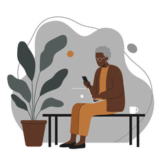 Senior woman focused on laptop and smartphone, embracing technology in a modern setting. Ideal for themes of remote work, education, or connected lifestyle.
