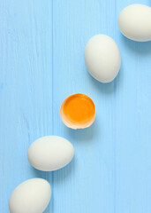 chicken eggs on a colored background. Farm products, natural eggs.. Vertical photo format