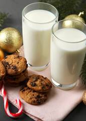 milk and Christmas cookies for Santa on the table. Christmas background. Vertical photo format